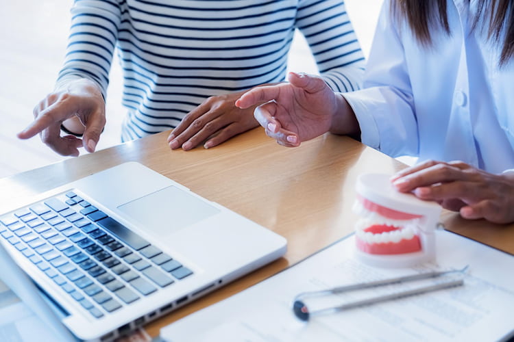 a dentist is helping a patient to apply for CDCP.
